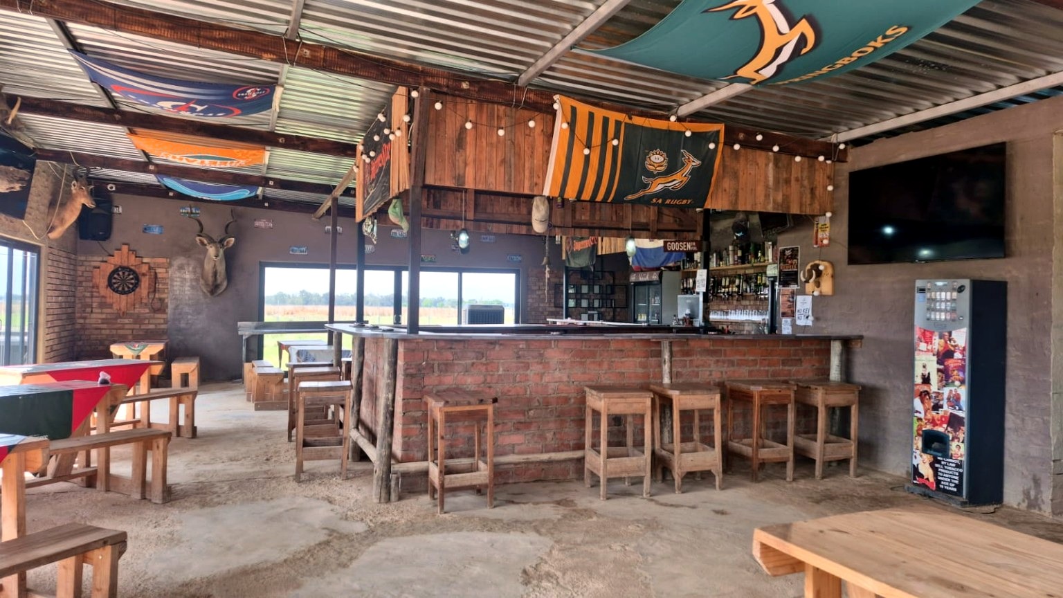 Inside the pub — seating, bar and sports screen